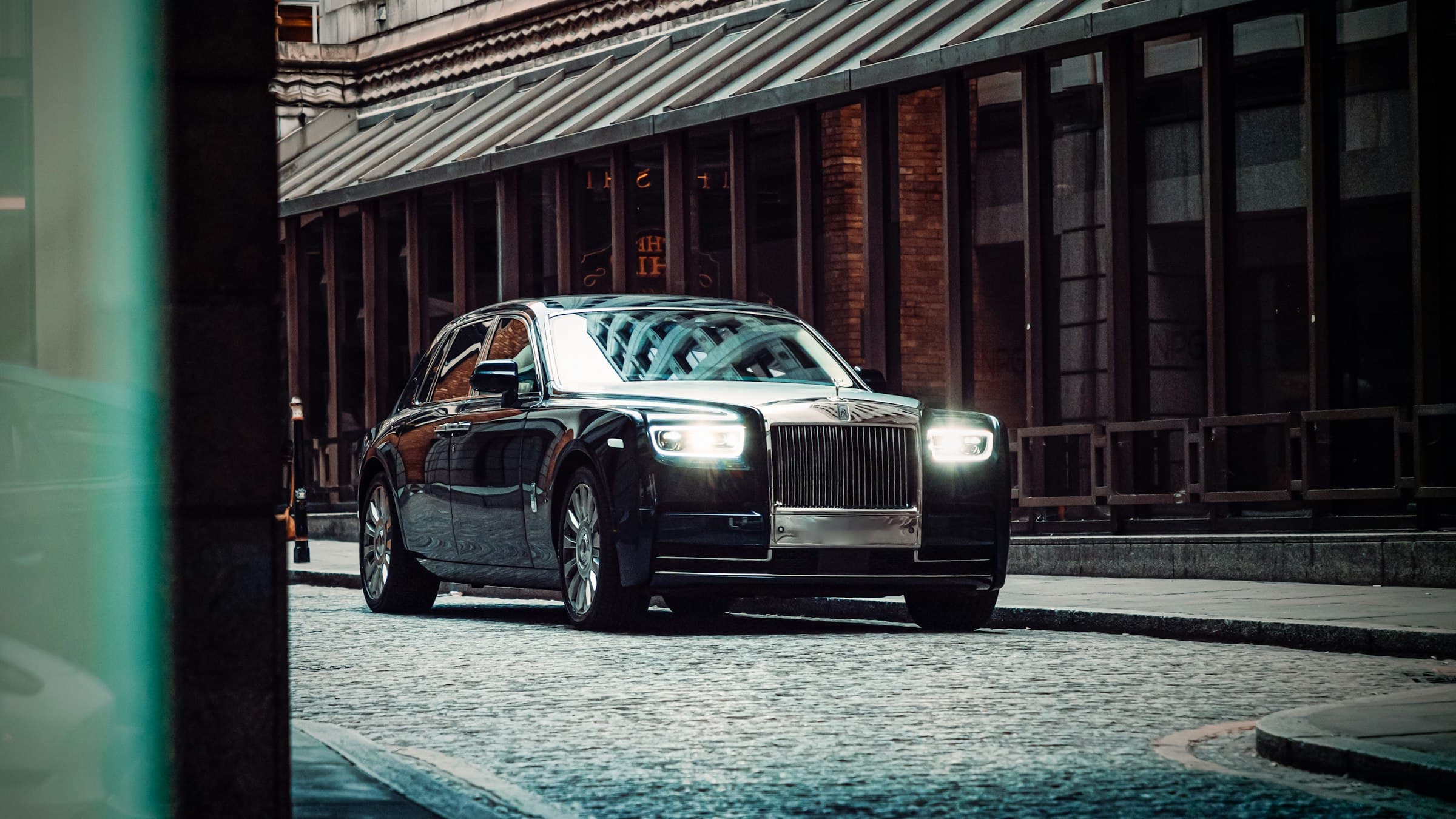 Black Rolls-Royce Phantom waiting kerbside on a London street