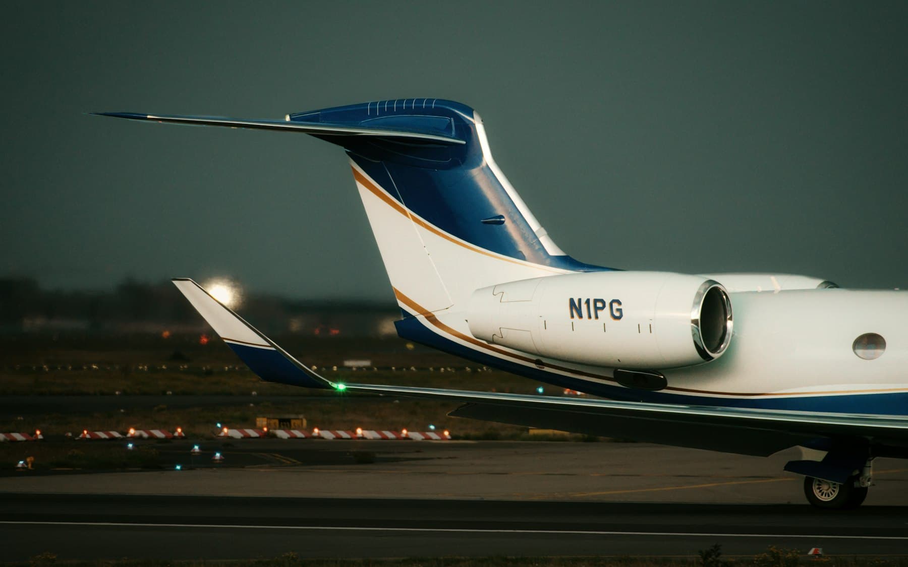 Private jet on the tarmac at dusk